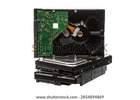 Stack of computer hard drives isolated on white background.