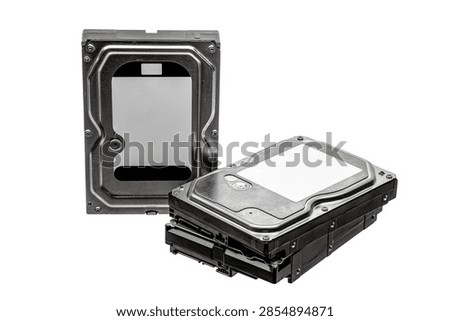 Stack of computer hard drives isolated on white background.