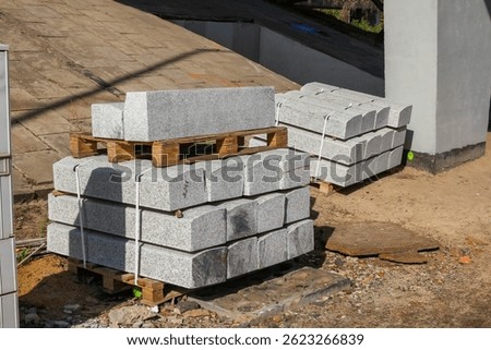 Stack of Concrete Building Blocks and Construction Materials on Construction Site