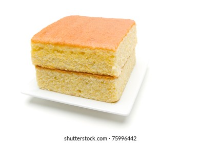 A Stack Of Corn Bread Slices On A White Plate.