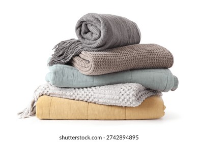 Stack of cozy blankets on white background