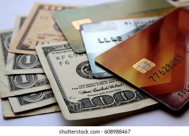 Stack of credit cards and american dollars, close-up view. Horizontal financial business background.