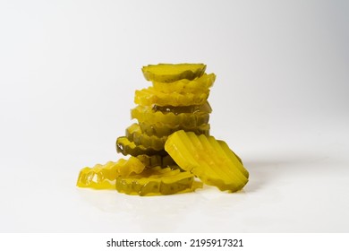 Stack Of Crinkle Cut Dill Pickle Chips Isolated In White Background