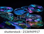 Stack of cryptocurrencies with wallet over dark background