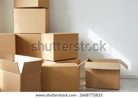 Stack of cupboards, heap of open boxes, multiple storage packing cabinets for delivery placed one on top of other and near, moving service items for packing goods, preparing transit containers 