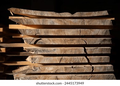 Stack of cut boards at the woodworker workshop, carpenter work, wood industry