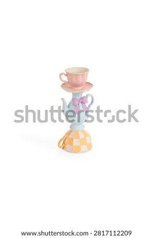 Stack of cute pink tea cup teapot and colorful checkered mug in a fun whimsical pixel art style design