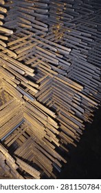 A stack of deformed steel bars arranged into mats or prefabricated frameworks, such as wire mesh or 