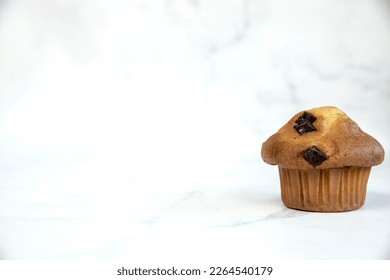 A stack of delicious chocolatechip banana muffins and blueberries on a white background, tasty healthy snack granola breakfast muffin food