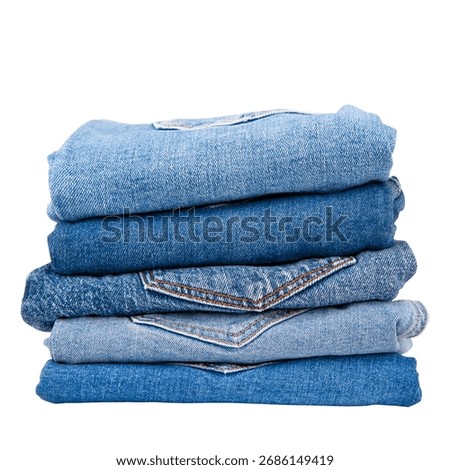 Stack of denim pants on isolated background.