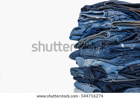 Stack of different blue jeans 