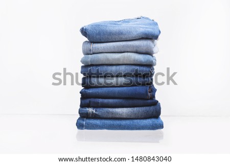 Stack of different blue jeans closeup
