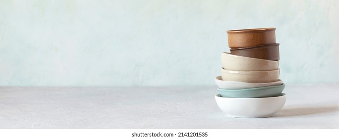 stack of different ceramic bowls, side view, banner, copy space, rustic style  - Powered by Shutterstock