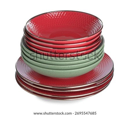 Stack of different ceramic dishware isolated on white