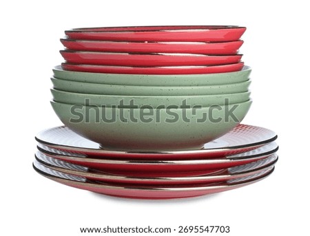 Stack of different ceramic dishware isolated on white