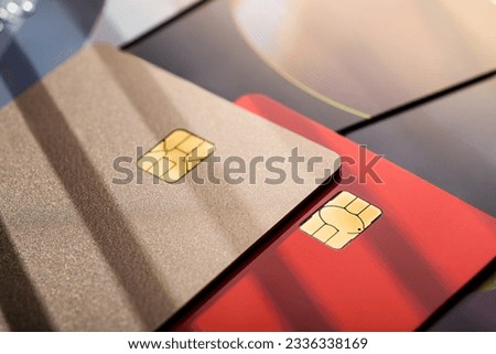 Stack of different credit cards, close up view with selective focus. Plastic card payment.