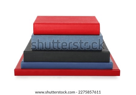 Stack of different hardcover books on white background