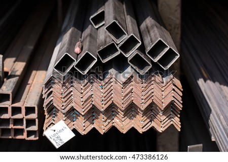 Stack of different iron bars and stainless steel profiles