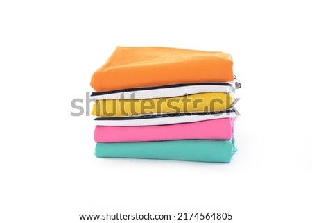 stack of different sweaters on white background 

