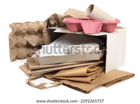 Stack of different waste paper on white background
