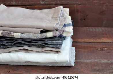 Stack Of Dish Towels On Wooden Background