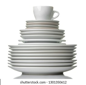 A Stack Of Dishes. Dinnerware. Plates And Cup On A White Isolated Background. Close-up.