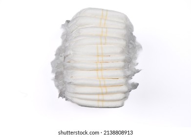 A Stack Of Disposable Baby Diapers Isolated On A White Background.The Concept Of Hygiene And Child Care.High Quality Photo