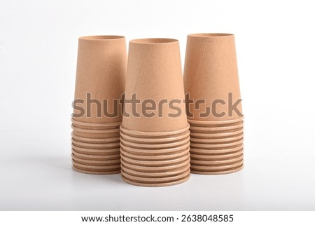 A stack of disposable coffee cups isolated on a white background. Paper cup, Takeaway paper coffee cup