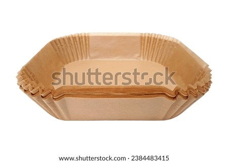 Stack of Disposable wax paper for your fryer isolated on white background with clipping path. Air fryer paper liner, front view close up.