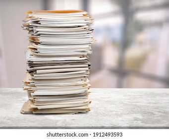 Stack Of Document Papers On Stone Desk