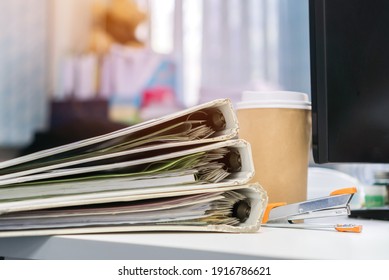 Stack Of Documents Binder Paper On Computer Tabel, Files Folder On Office Desk, Annual Report Document For Business Papers Financial In Desktop Offices, Lawyer Research Achieves Work In Information