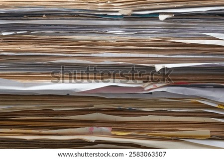 stack of documents in close-up, pile of old used disorganized papers stored abstract background, disorganization or messy arrangement, backlog of paperwork or unfinished tasks concept