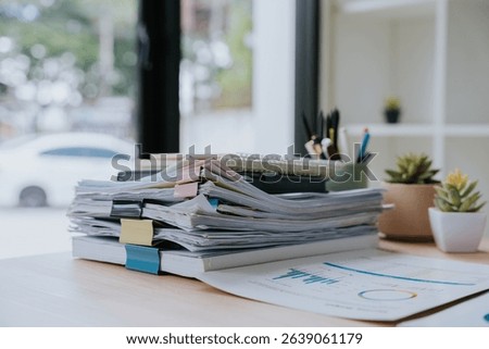Stack of Documents on Desk
