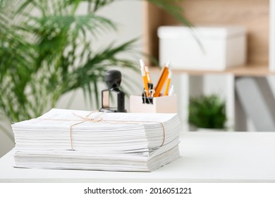 Stack of documents on table in office