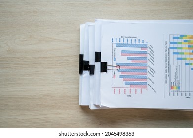 Stack Of Documents With Paper Clip Folder Placed On A Business Desk In A Business Office.