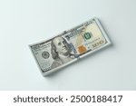 Stack of dollar banknotes on white background, top view