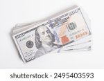 Stack of dollar bills scrolling. Banknotes, American dollars isolated on a white background, U.S. dollars. $100 bills