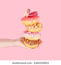 Stack of Donuts held by hand