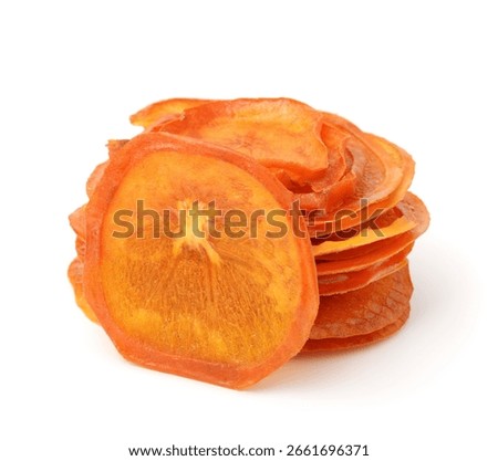 Stack of dried slices of persimmon fruit isolated on white