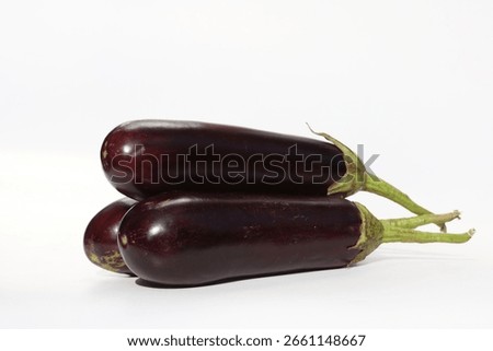 a stack of eggplants isolated on white background