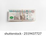 Stack of Egyptian 100 Pound Banknotes isolated in white Background