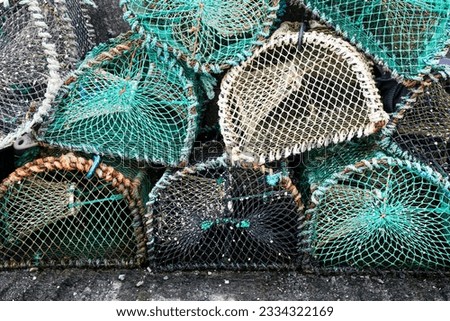 A stack of the empty fishermen lobster pots at Elgol village harbor on the Isle of Skye, Scotland