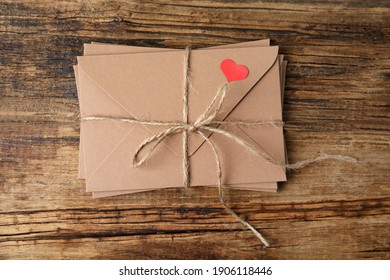 Stack Of Envelopes On Wooden Table, Top View. Love Letters