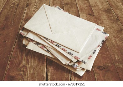 Stack Of Envelopes On Wooden Table