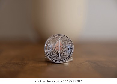Stack of ether coins or ethereum on silver background to illustrate blockchain and cyber currency.