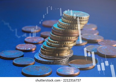 Stack Of Euro Coins And Market Chart Graph With Downward Trend, Loss Of Value. Soft Focus