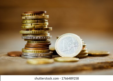 Stack Of Euro Coins On A Wooden Table
