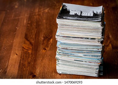 Stack Of Few Hundrets Old Postcards Collection On Table