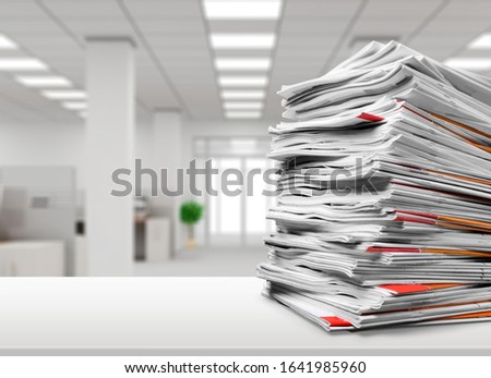 Stack file folders with documents on the desk