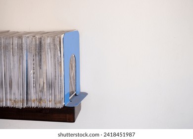 stack of files CD and books on shelf with white background
